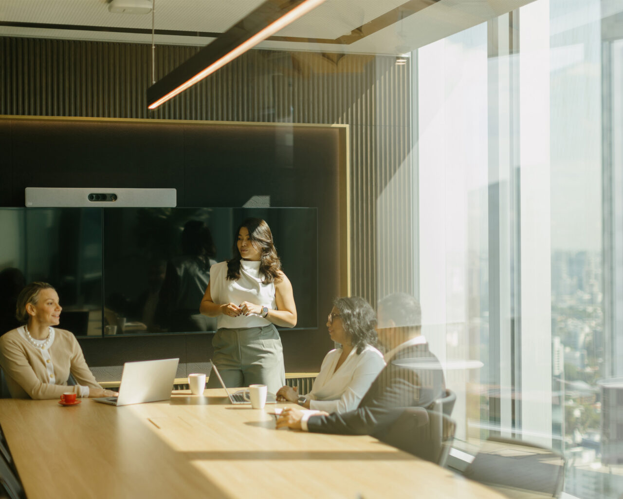 a group of people discussing in a board room